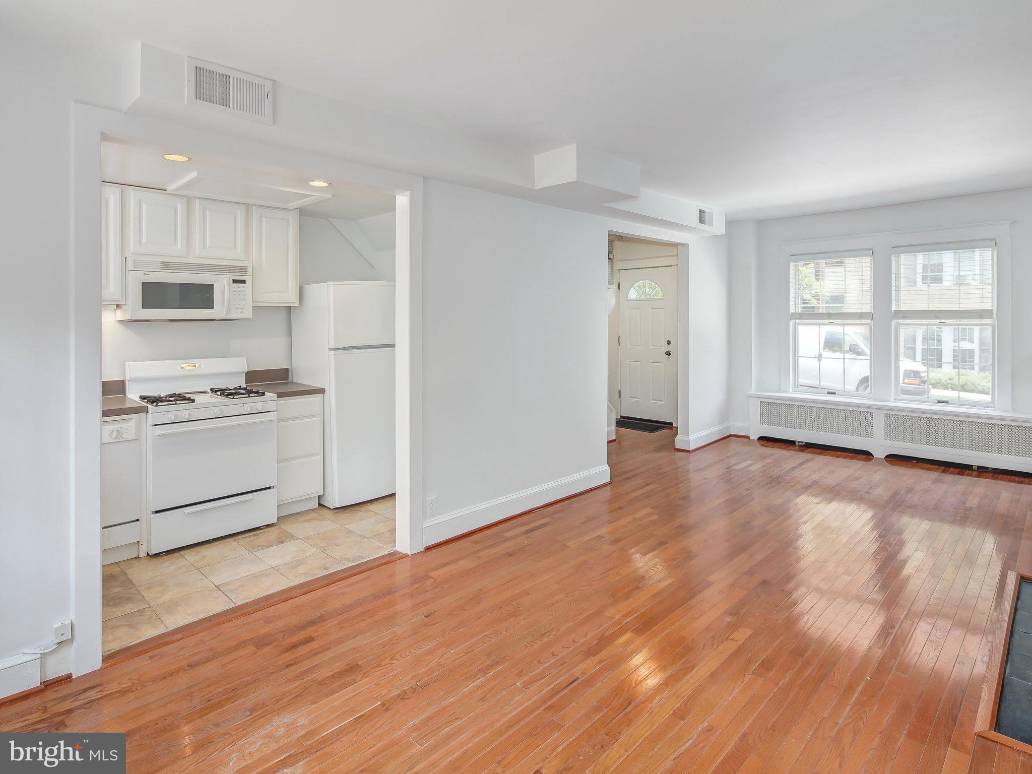 1920 35th Place Northwest Washington, DC 20007 - Photo 12 of 30 a view of kitchen with wooden floor electronic appliances and window