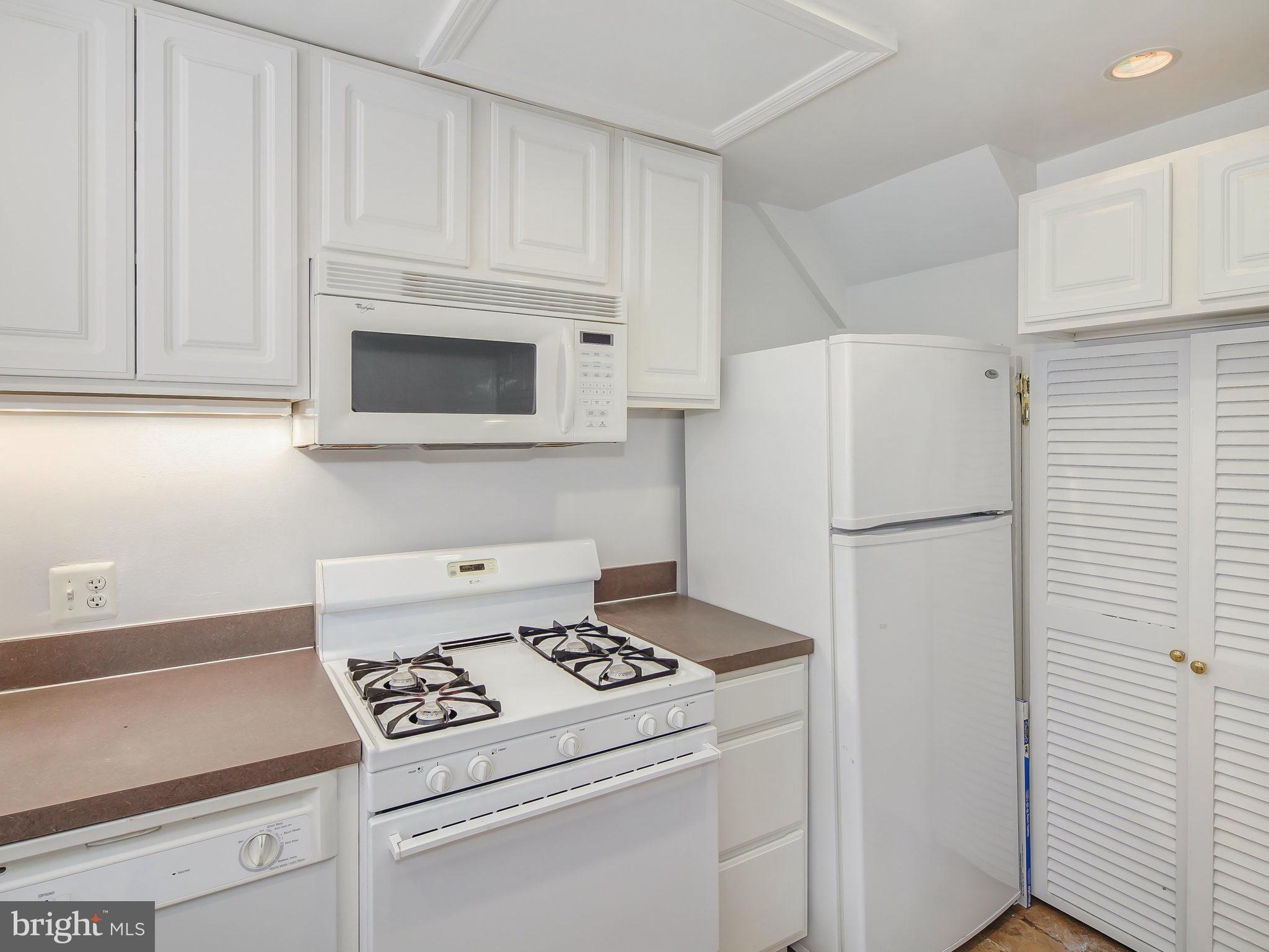 1920 35th Place Northwest Washington, DC 20007 - Photo 14 of 30 a kitchen with a stove and a refrigerator