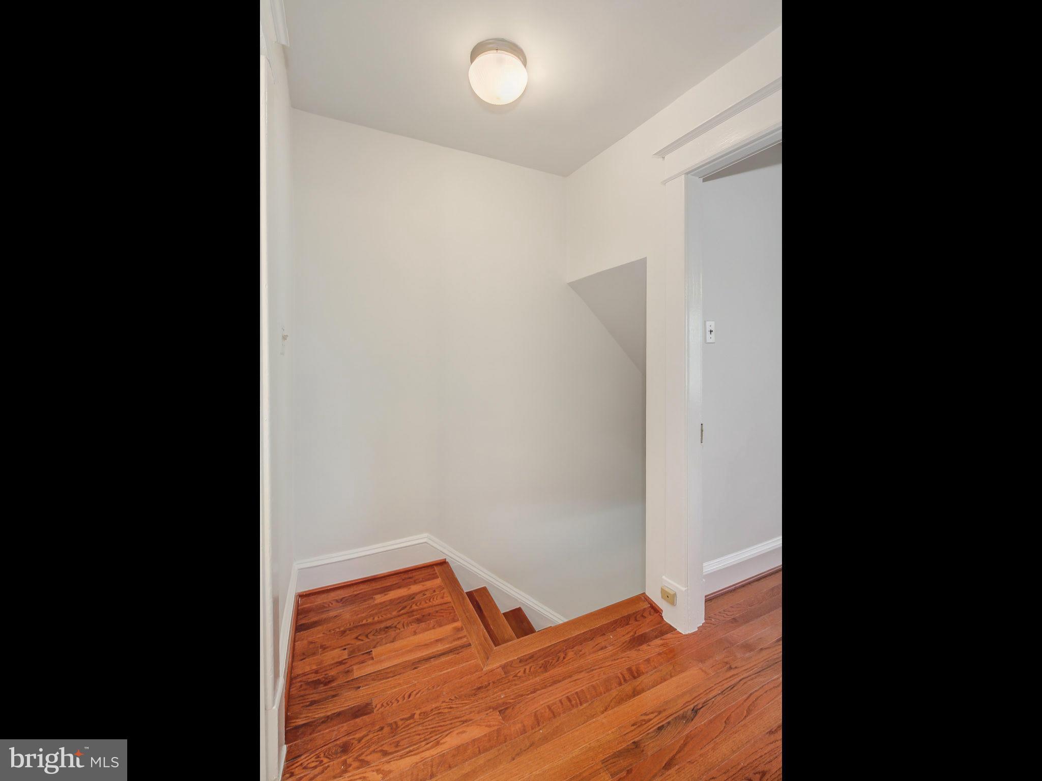 1920 35th Place Northwest Washington, DC 20007 - Photo 18 of 30 a view of a room with wooden floor