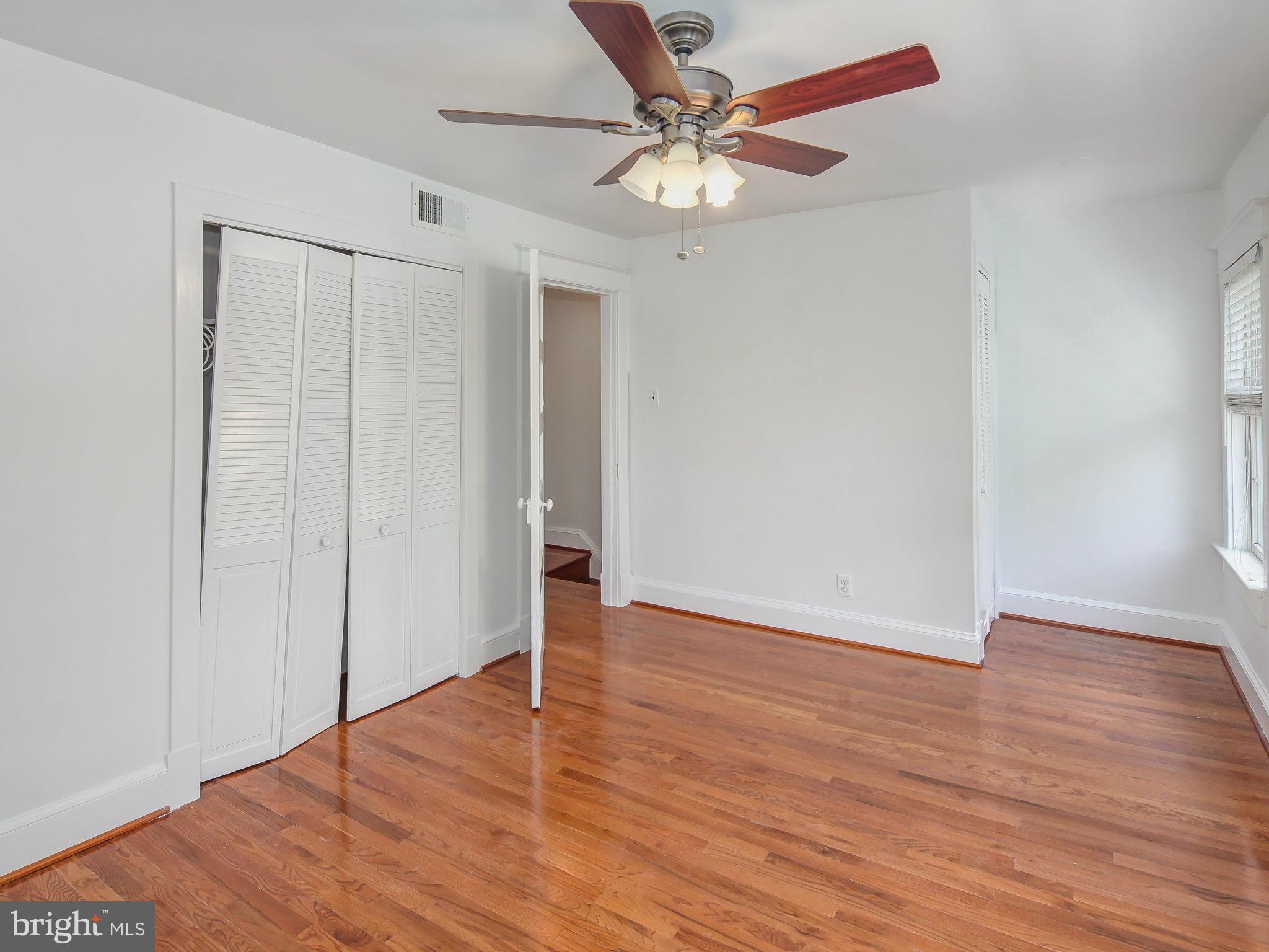 1920 35th Place Northwest Washington, DC 20007 - Photo 22 of 30 a view of an empty room with wooden floor
