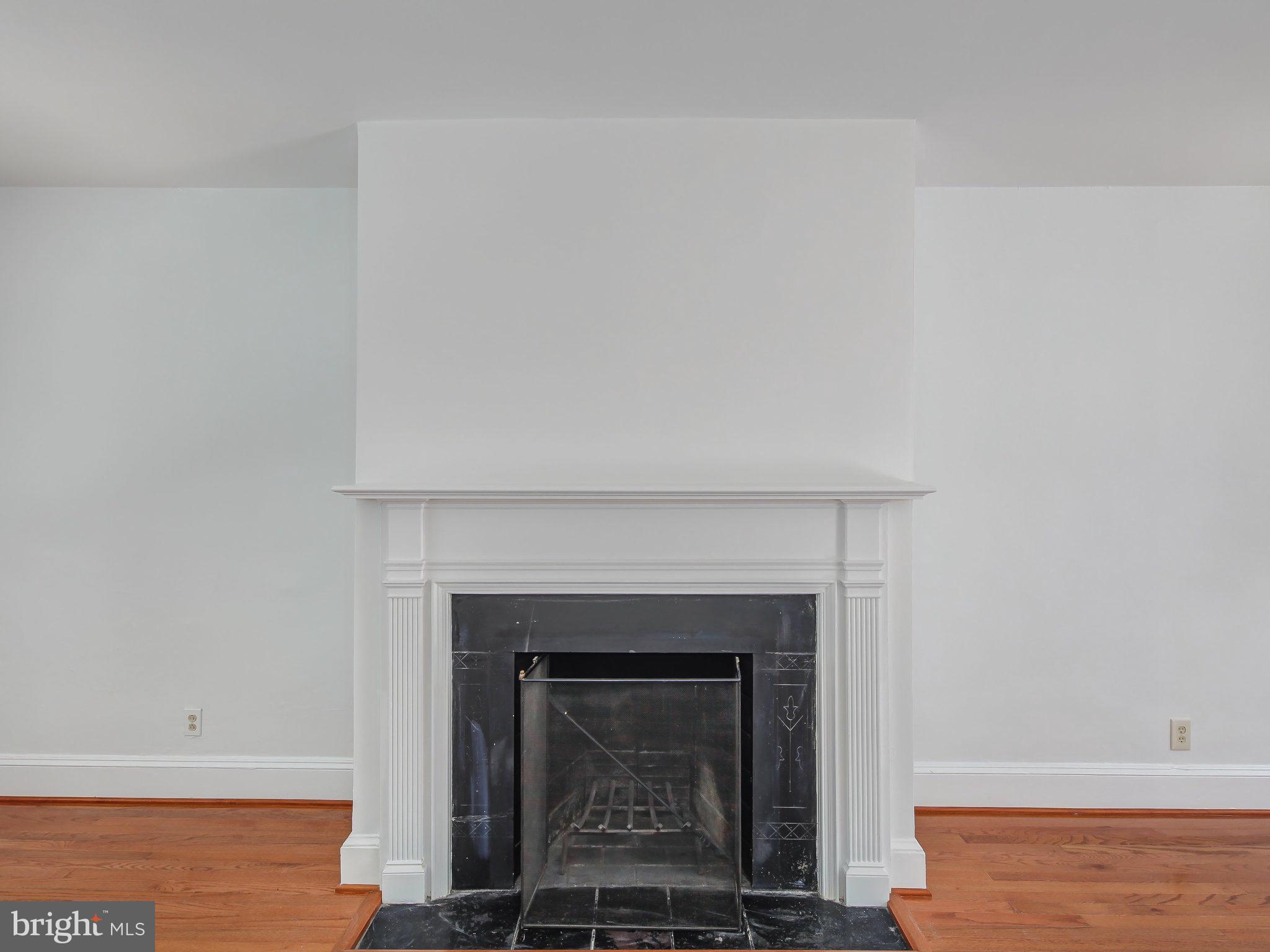 1920 35th Place Northwest Washington, DC 20007 - Photo 8 of 30 a living room with a fireplace