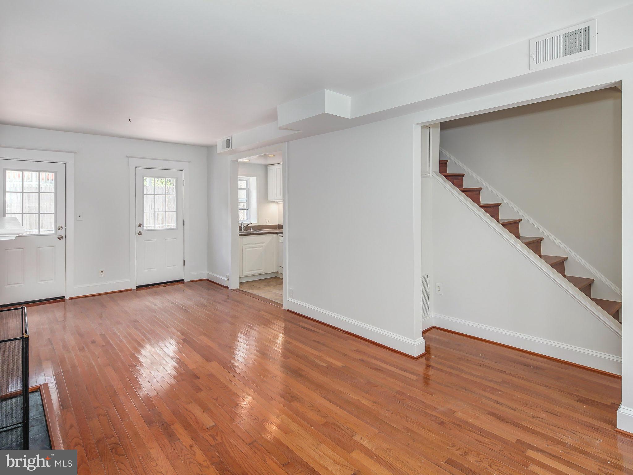 1920 35th Place Northwest Washington, DC 20007 - Photo 10 of 30 a view of empty room with wooden floor and fan