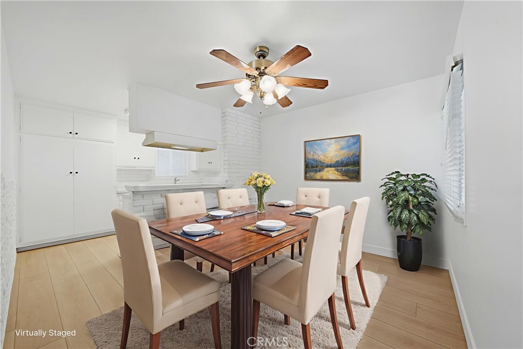 11709 Pounds Avenue Whittier, CA 90604 - Photo 11 of 39 a view of a dining room with furniture and wooden floor