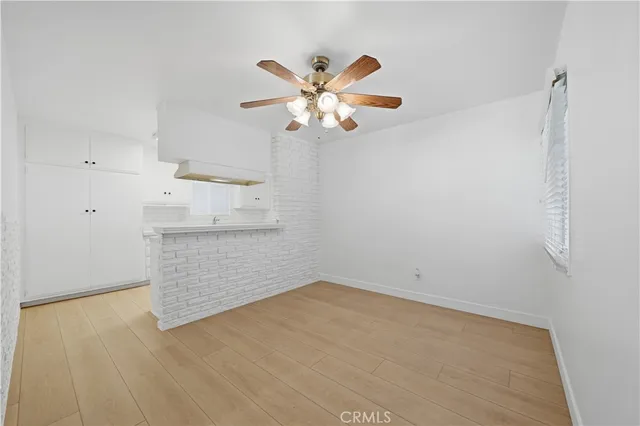 a bathroom with a toilet sink a mirror and shower