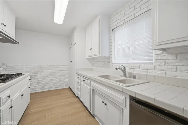 a bathroom with a toilet sink a mirror and shower