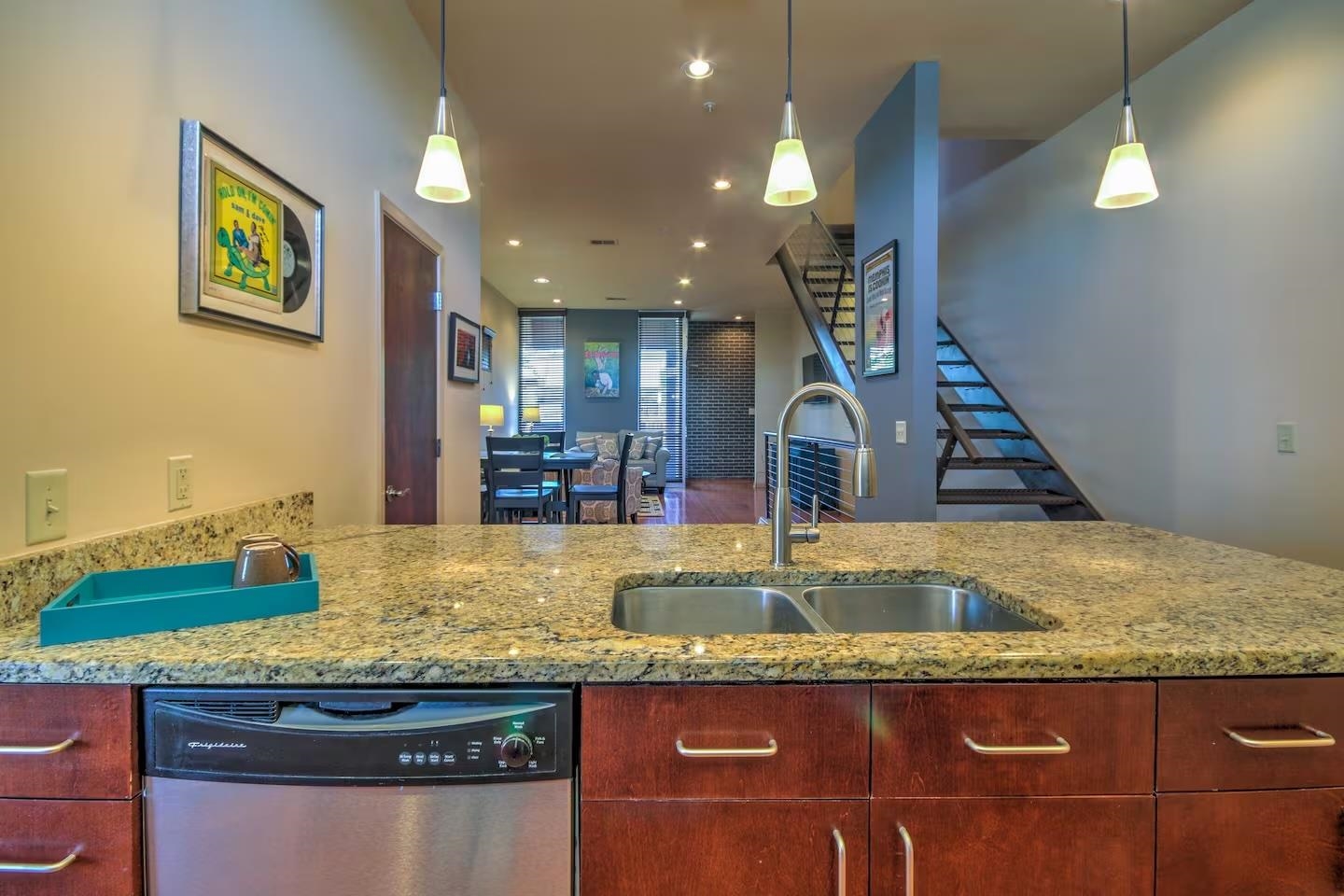 449 Monroe Avenue, Unit 115 Memphis, TN 38103 - Photo 6 of 35 a view of kitchen countertops with granite countertop kitchen island stainless steel appliances and a counter top