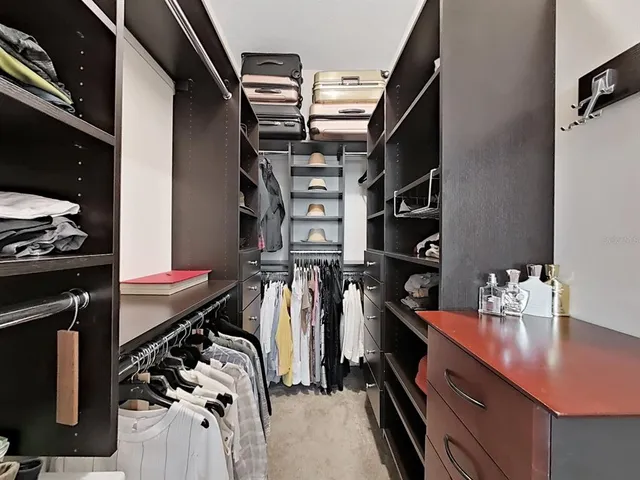 a bathroom with a double vanity sink and mirror with shower