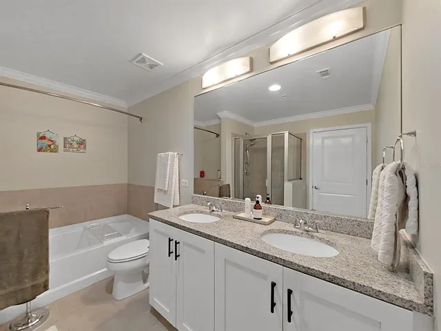 a bathroom with a white bath tub and a shower