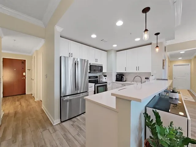 a kitchen with sink cabinets and window