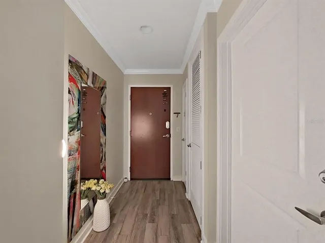 a view of a chair and tables in the patio