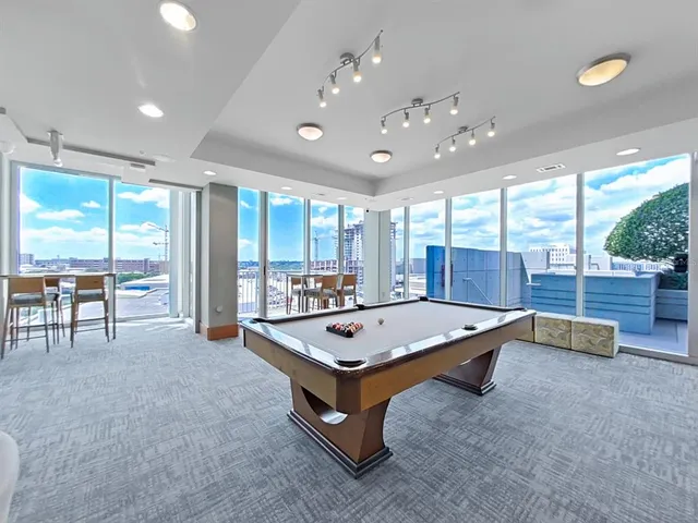 a view of livingroom with furniture and floor to ceiling window