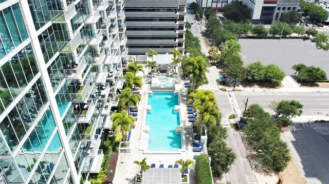 an aerial view of a residential apartment building with plants and flowers