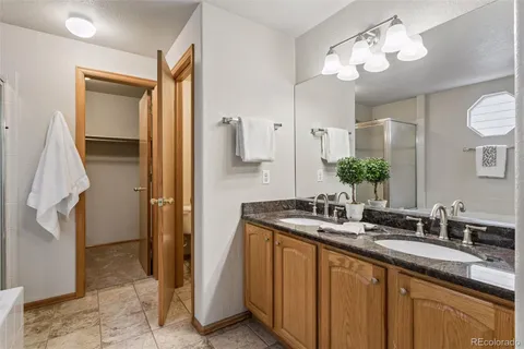 a bathroom with a sink double vanity and a mirror