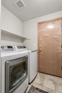 a view of washer and dryer in a room
