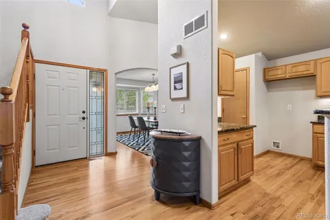 a kitchen with a refrigerator and a stove