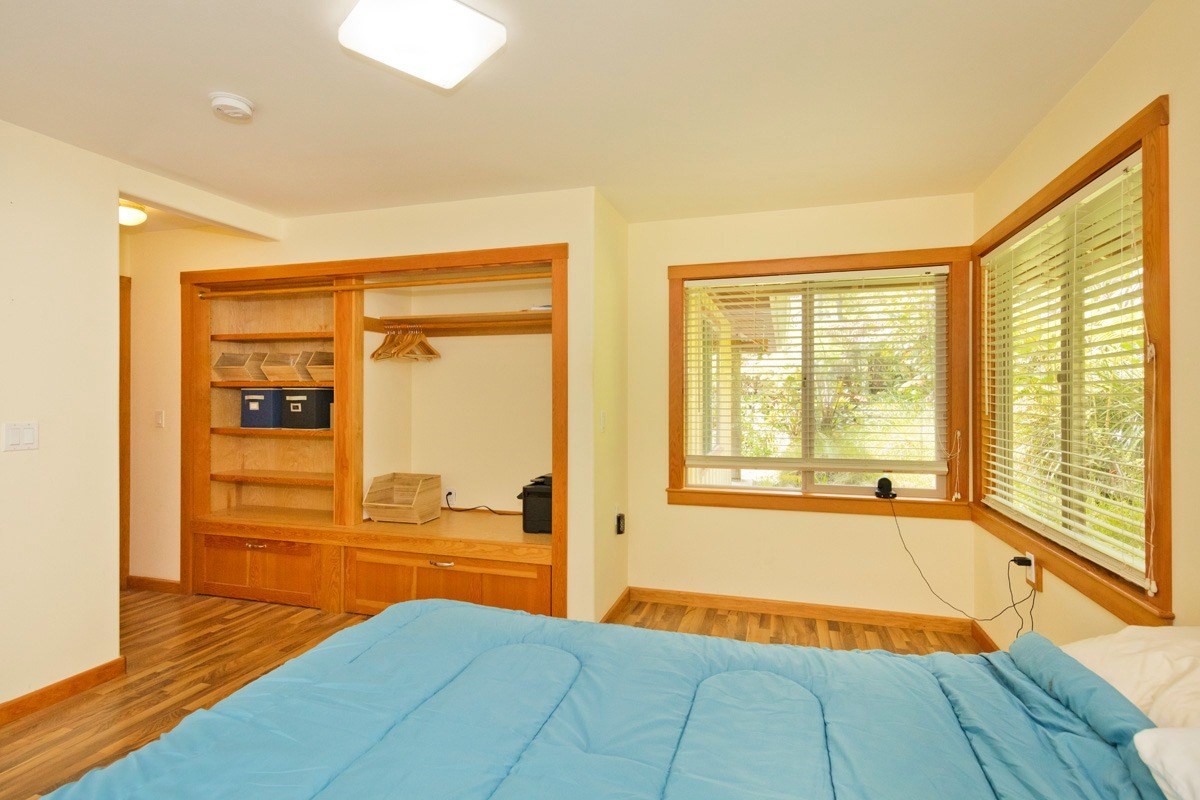 19-3882 Old Volcano Road Volcano, HI 96785 - Photo 11 of 30 a view of an empty room with wooden floor and a window