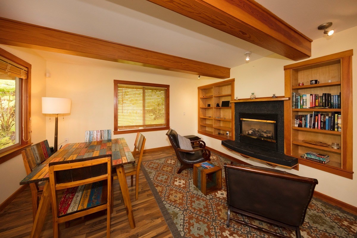 19-3882 Old Volcano Road Volcano, HI 96785 - Photo 5 of 30 a living room with furniture fireplace and flat screen tv