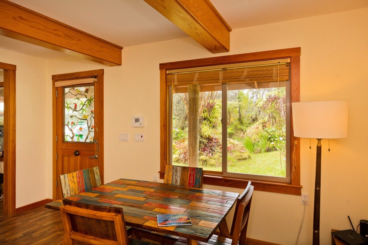 19-3882 Old Volcano Road Volcano, HI 96785 - Photo 7 of 30 a view of a dining room with furniture window and wooden floor