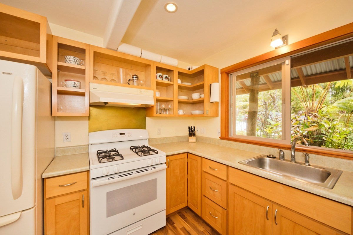 19-3882 Old Volcano Road Volcano, HI 96785 - Photo 9 of 30 a kitchen that has a sink and a stove