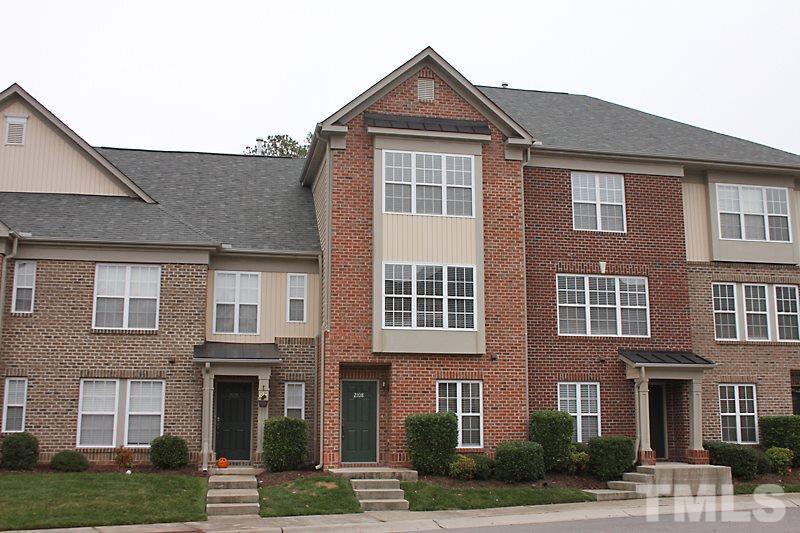 Three level Town Home with brick front and plenty of windows.