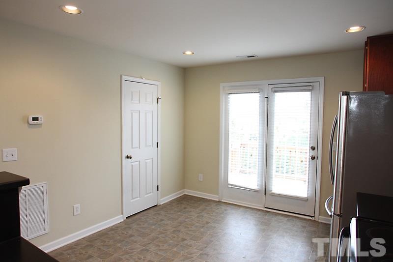 Kitchen area with door leading out to the balcony.