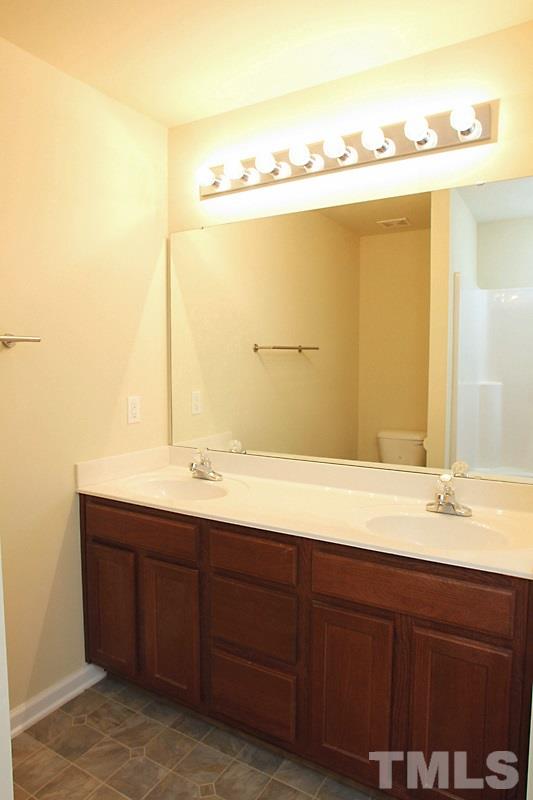 2108 Kedvale Avenue Raleigh, NC 27617 - Photo 8 of 13 Master Bath with double sink.