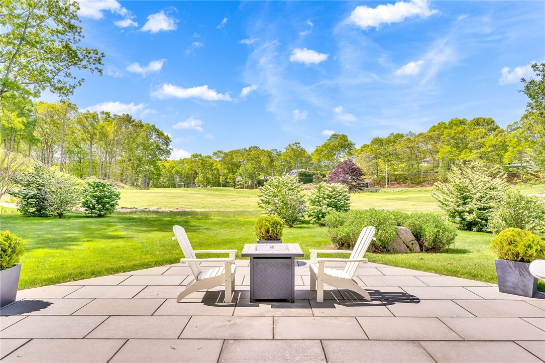 5 Wicklow Road Westerly, RI 02891 - Photo 2 of 37 A recently added bluestone terrace graces the back lawn.
