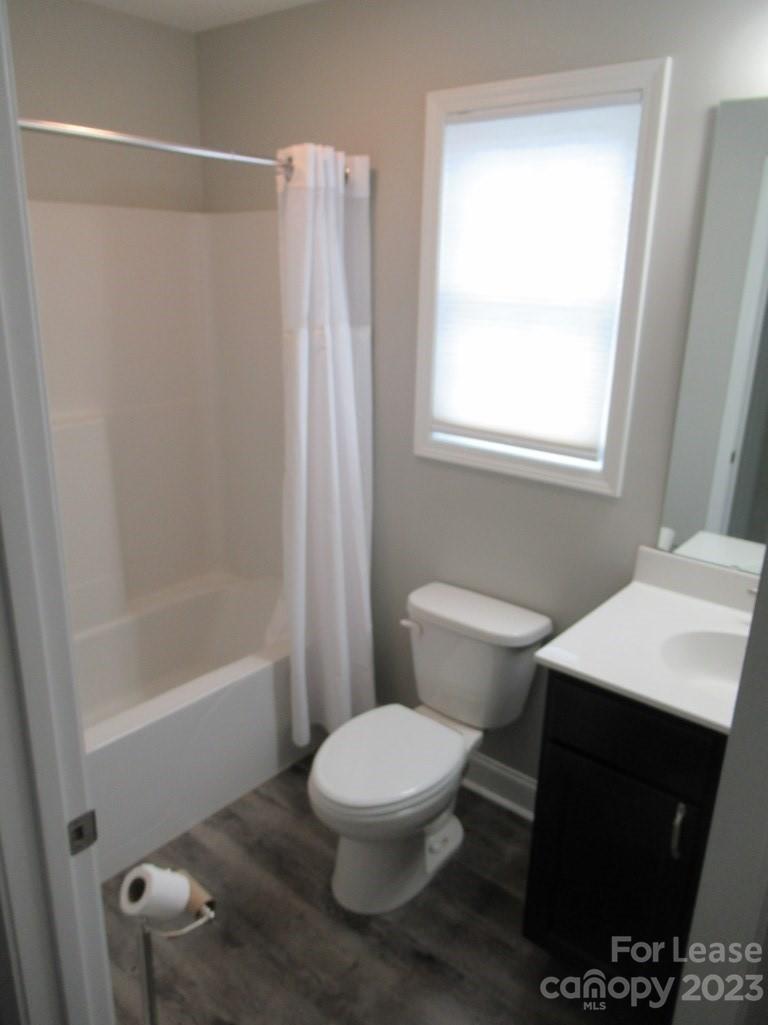 602 Victory Grove Church Road Lincolnton, NC 28092 - Photo 8 of 13 a bathroom with a toilet a sink and a bathtub