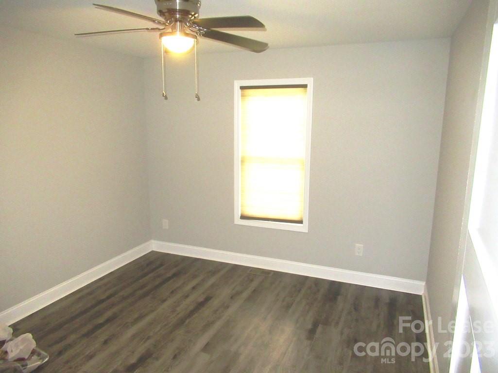 602 Victory Grove Church Road Lincolnton, NC 28092 - Photo 9 of 13 an empty room with a window and wooden floor