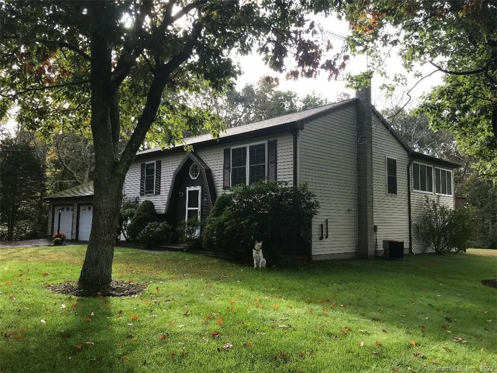 341 Dow Road Plainfield, CT 06374 - Photo 1 of 1 a view of a house with backyard and a tree