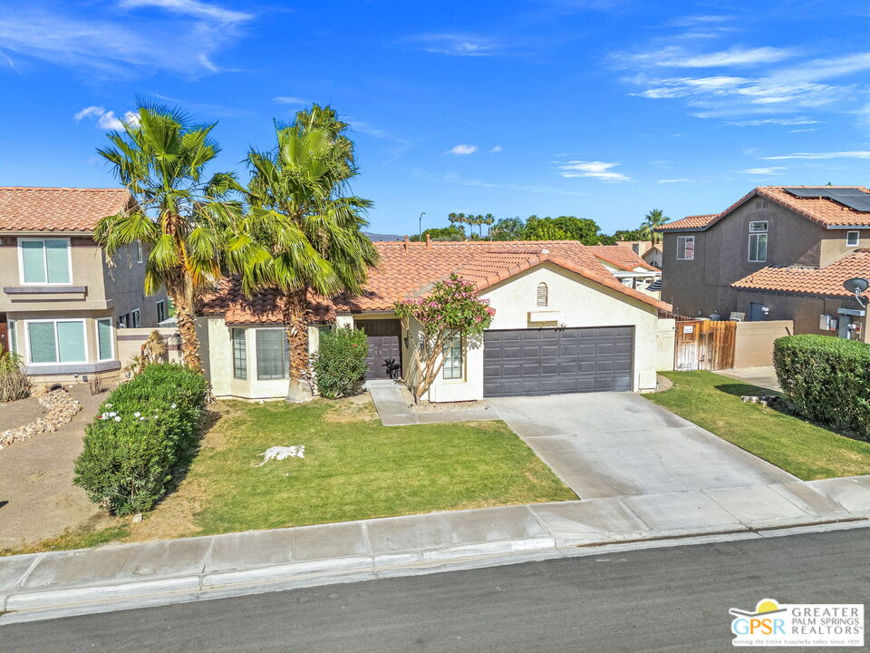 45688 Sutter Creek Road Indio, CA 92201 - Photo 51 of 51 a front view of a house with a yard and garage
