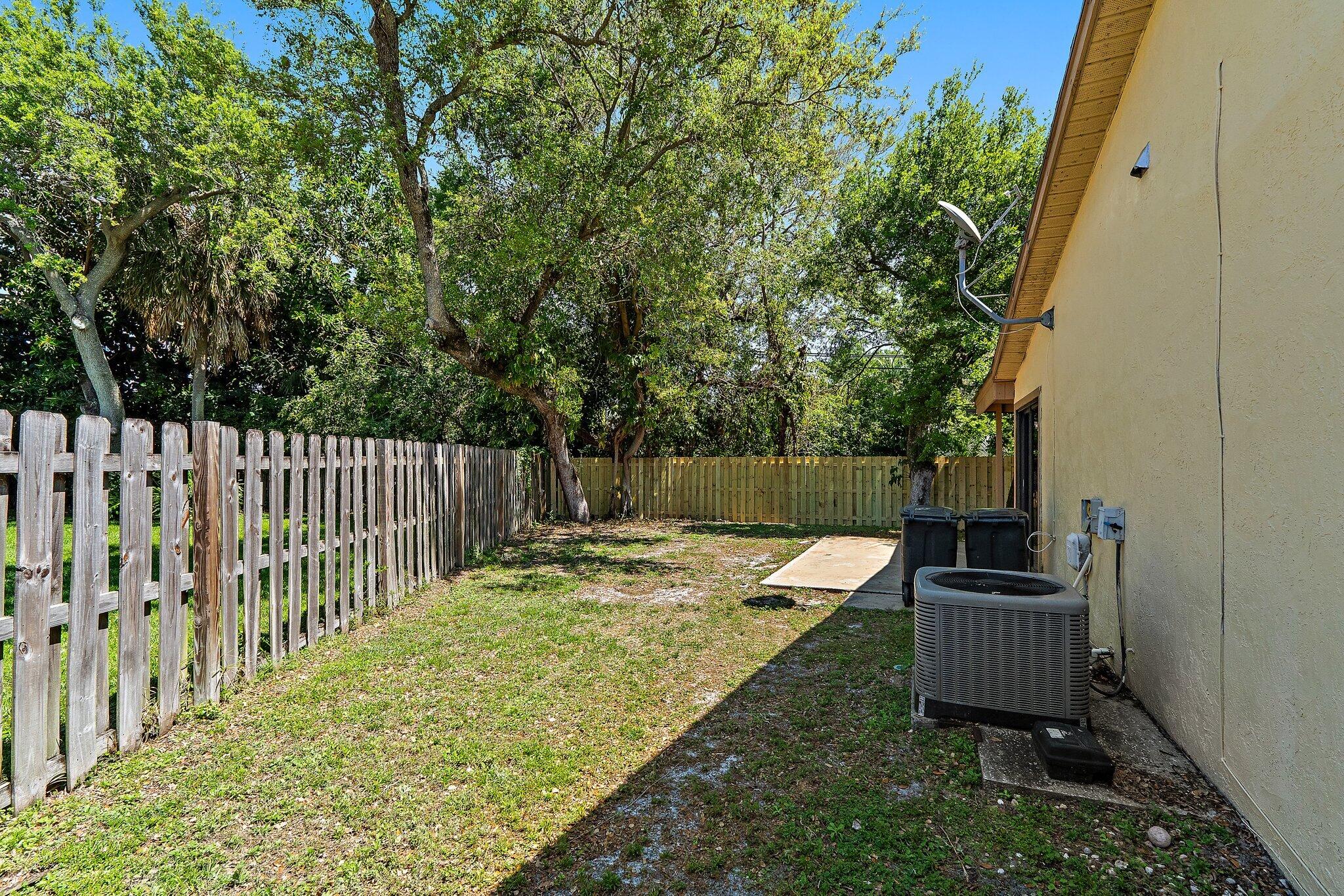 1007 Raintree Lane Palm Beach Gardens, FL 33410 - Photo 43 of 58 side yard 3