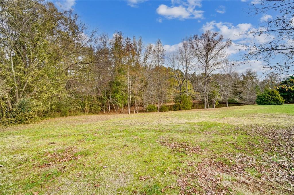 1813 Medlin Road Monroe, NC 28112 - Photo 41 of 45 a view of beach and yard