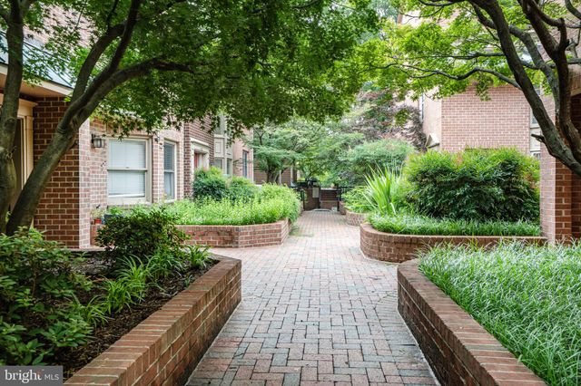 a view of house with backyard and garden