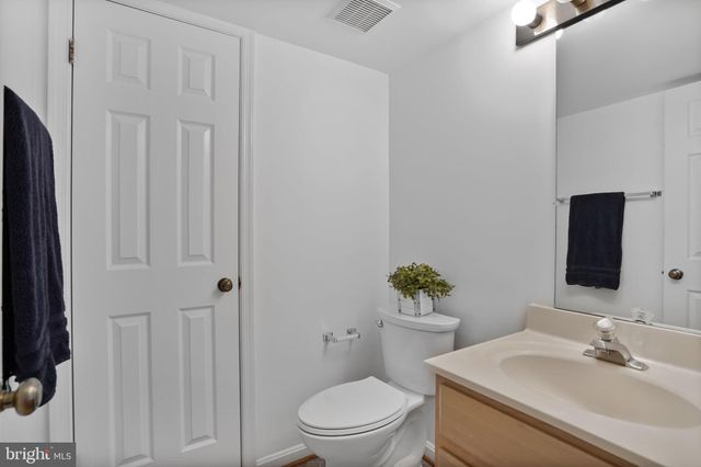 a bathroom with a sink a toilet and tub