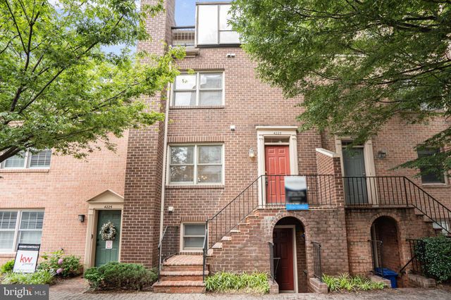 front view of a brick house with a large windows