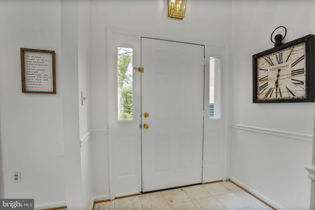 a view of an entryway with front door
