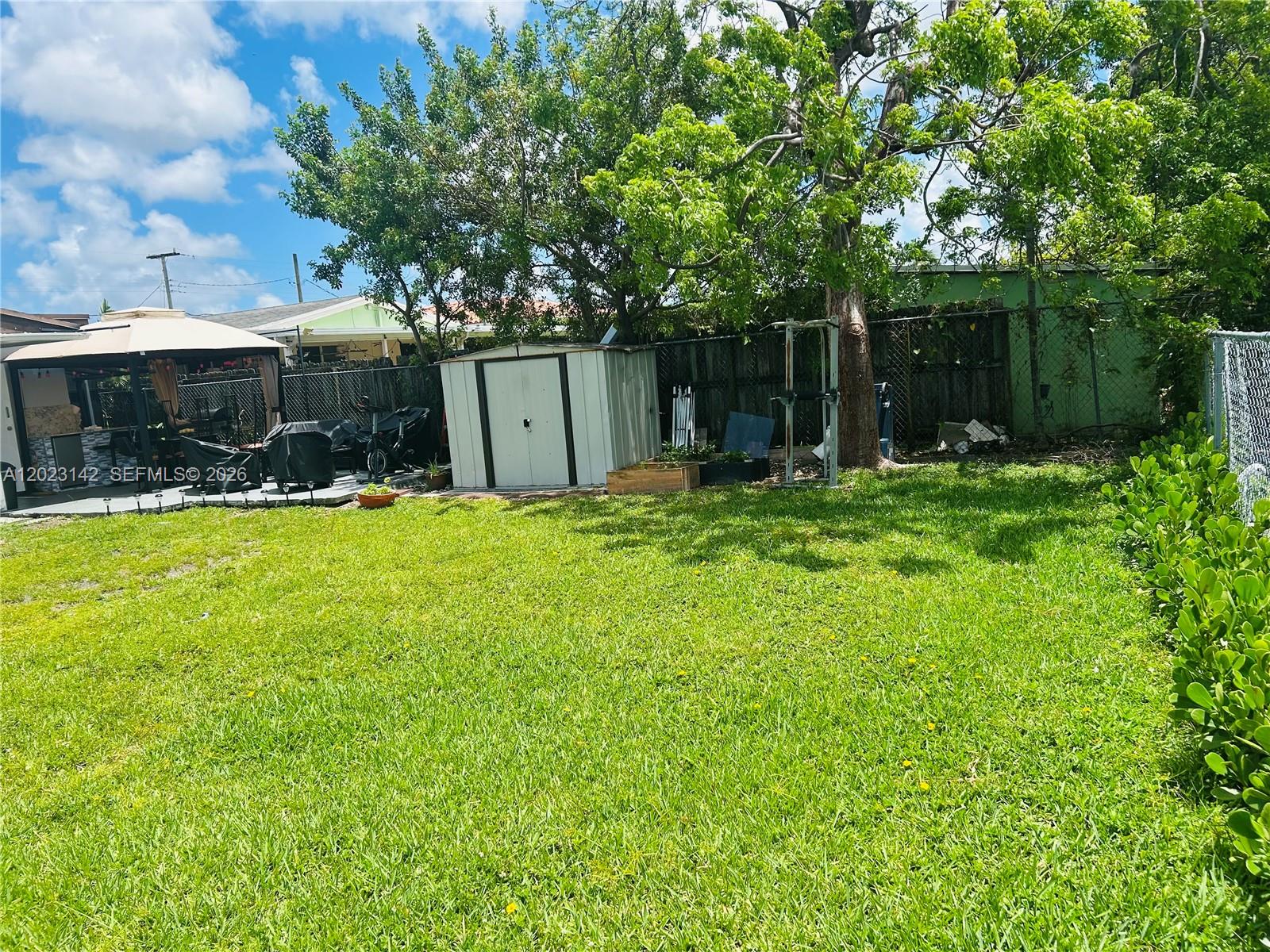 3410 Southwest 89th Court Miami, FL 33165 - Photo 18 of 18 a swimming pool with outdoor seating and yard