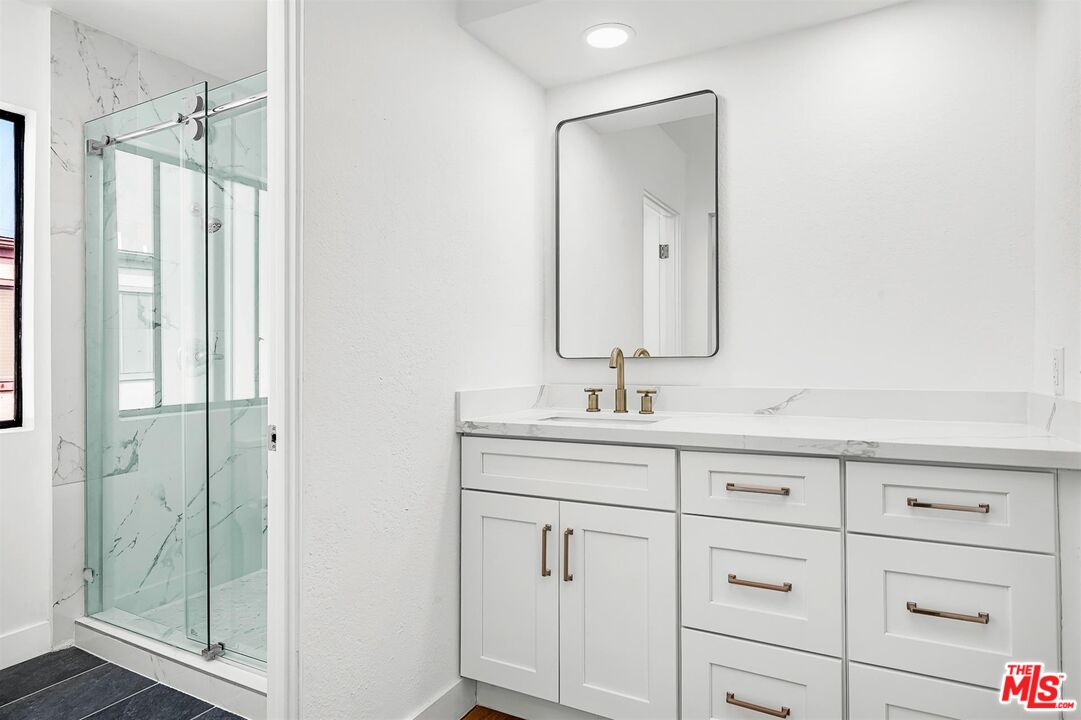 4425 Alla Road, Unit 5 Marina del Rey, CA 90292 - Photo 24 of 30 a bathroom with a sink and a mirror