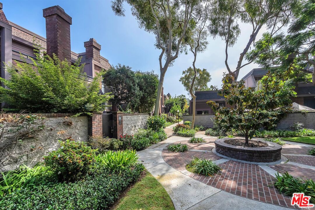 4425 Alla Road, Unit 5 Marina del Rey, CA 90292 - Photo 4 of 30 a view of a backyard with plants and a water fountain