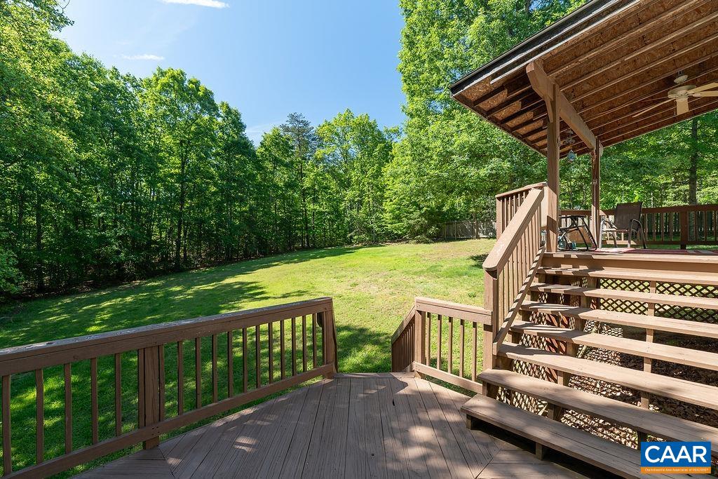 2851 Martin Kings Road Scottsville, VA 24590 - Photo 63 of 67 a view of a patio with wooden floor and roof with a garden