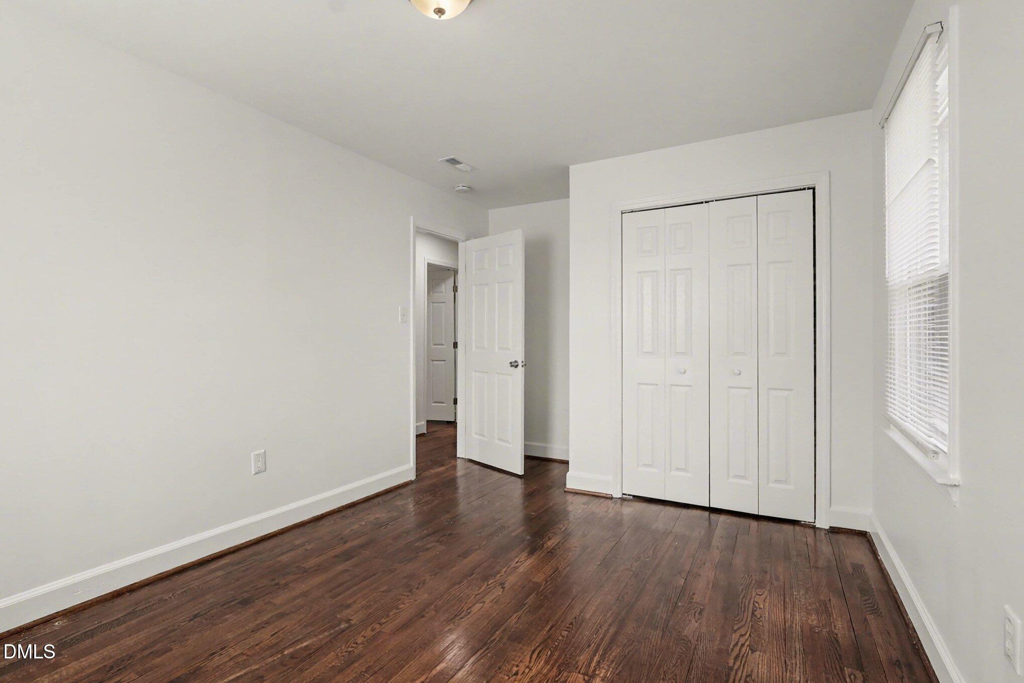3043 Creech Road Garner, NC 27529 - Photo 22 of 38 a view of an empty room and wooden floor