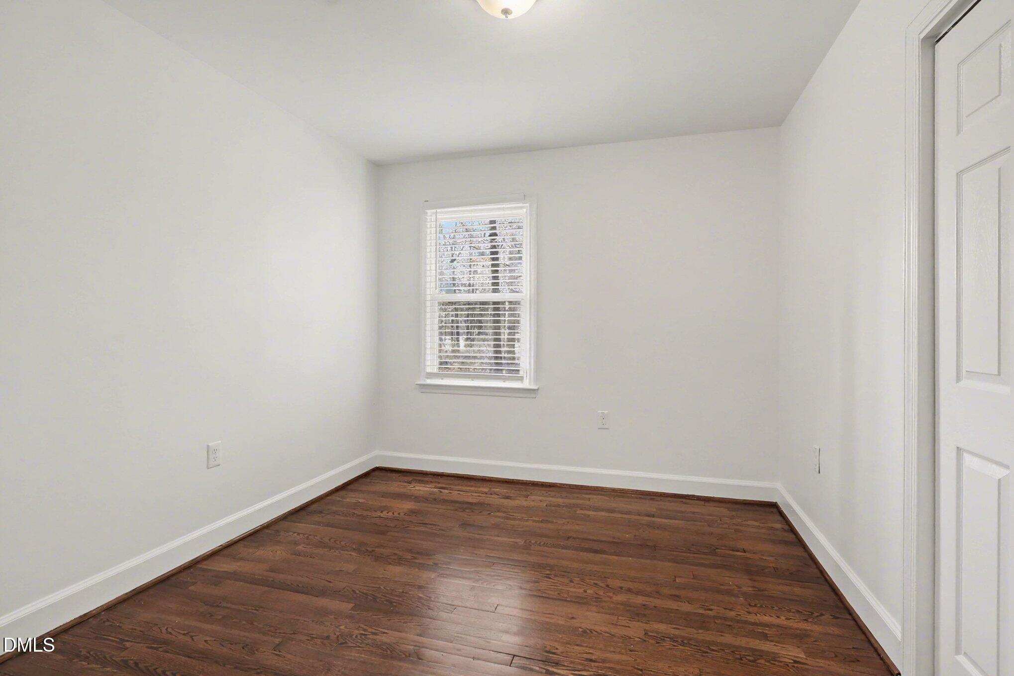 3043 Creech Road Garner, NC 27529 - Photo 23 of 38 wooden floor in an empty room with a window