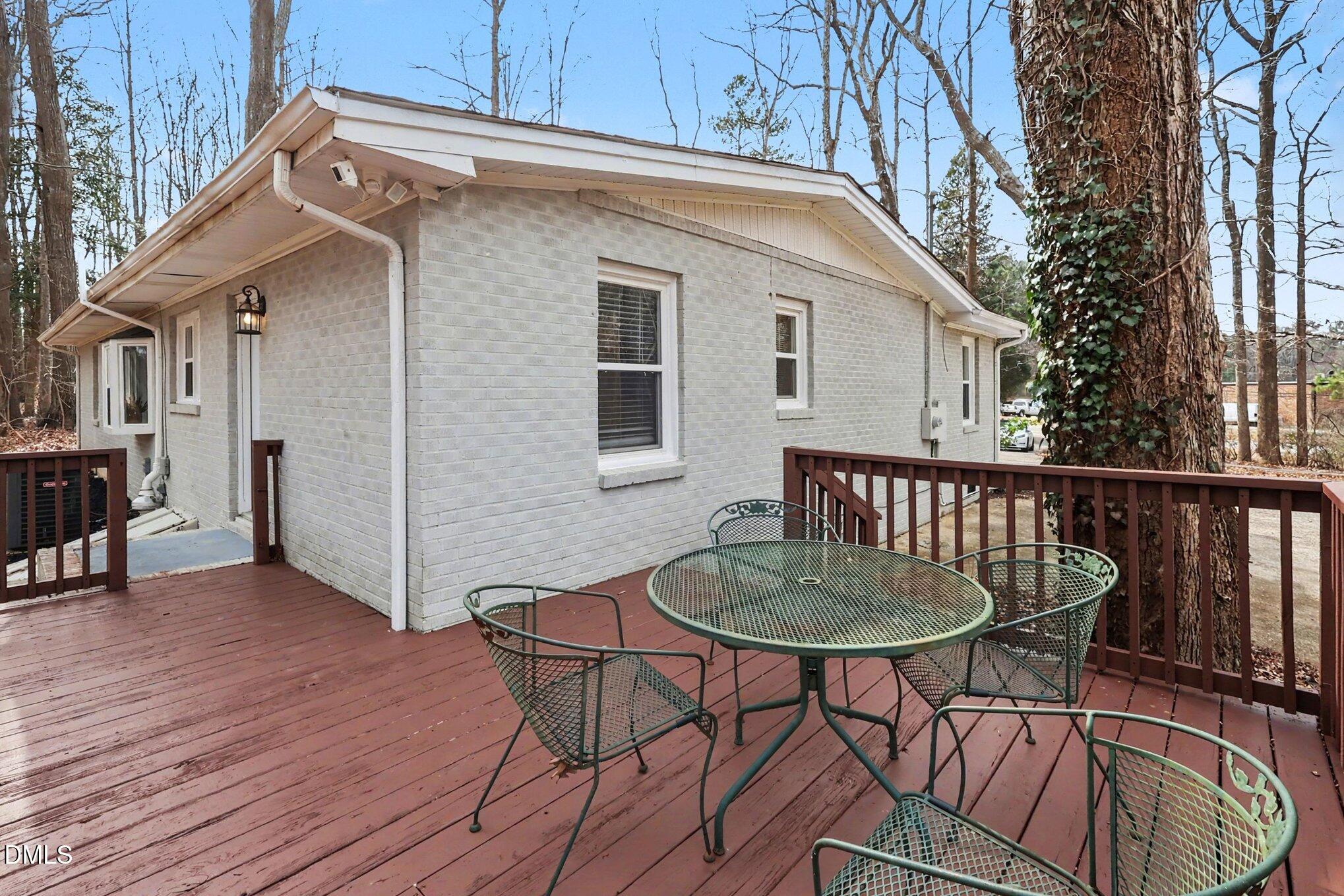 3043 Creech Road Garner, NC 27529 - Photo 25 of 38 a balcony with table and chairs