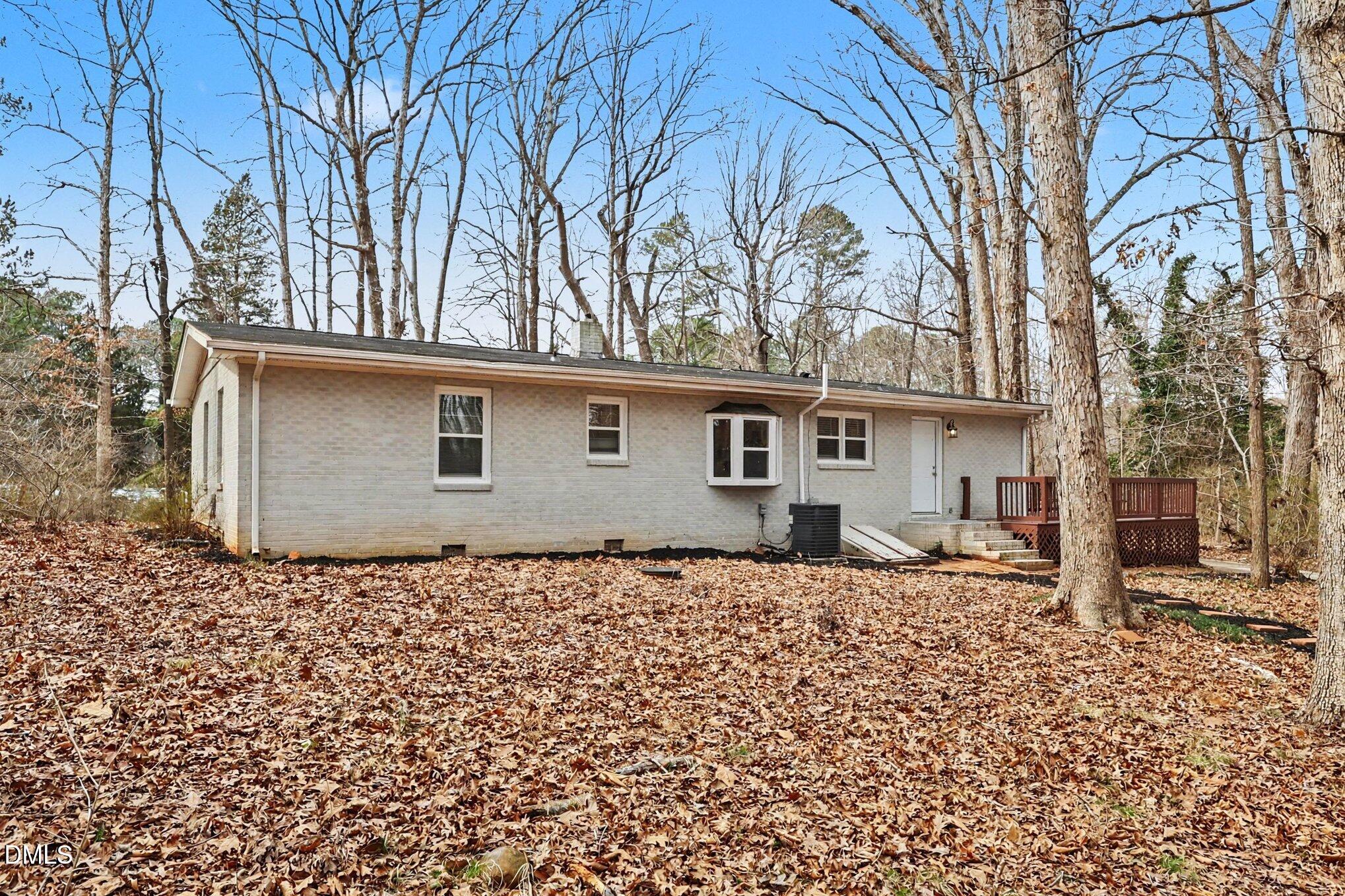 3043 Creech Road Garner, NC 27529 - Photo 28 of 38 front view of a house with a bench