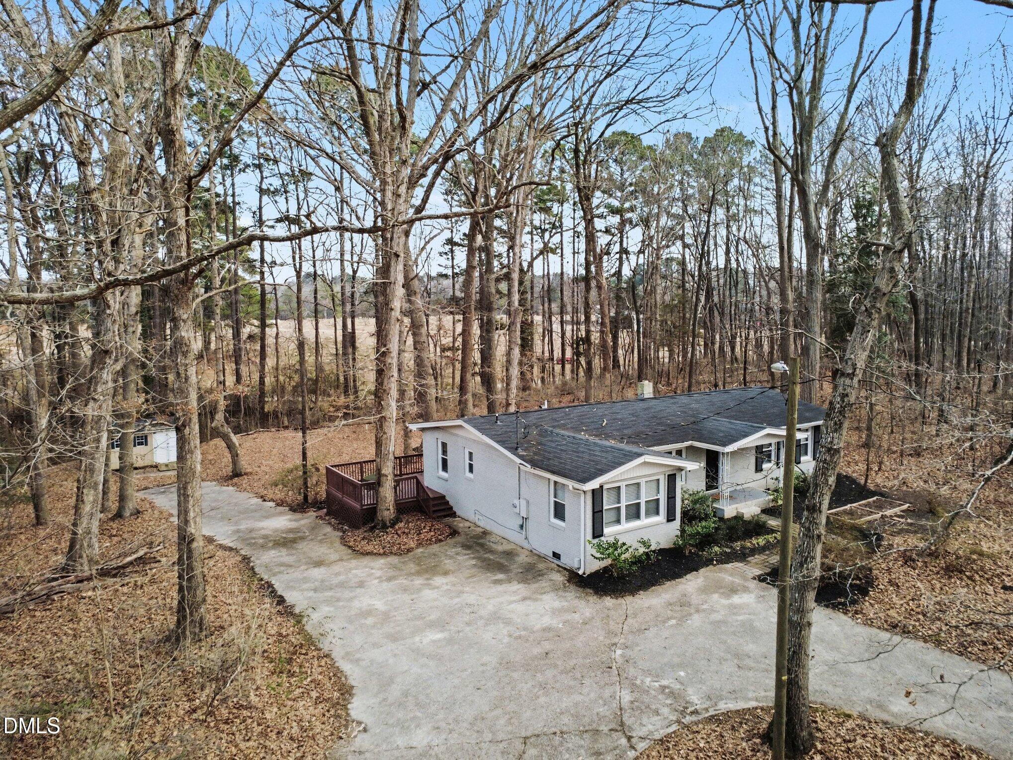 3043 Creech Road Garner, NC 27529 - Photo 30 of 38 a view of a house with backyard and sitting area