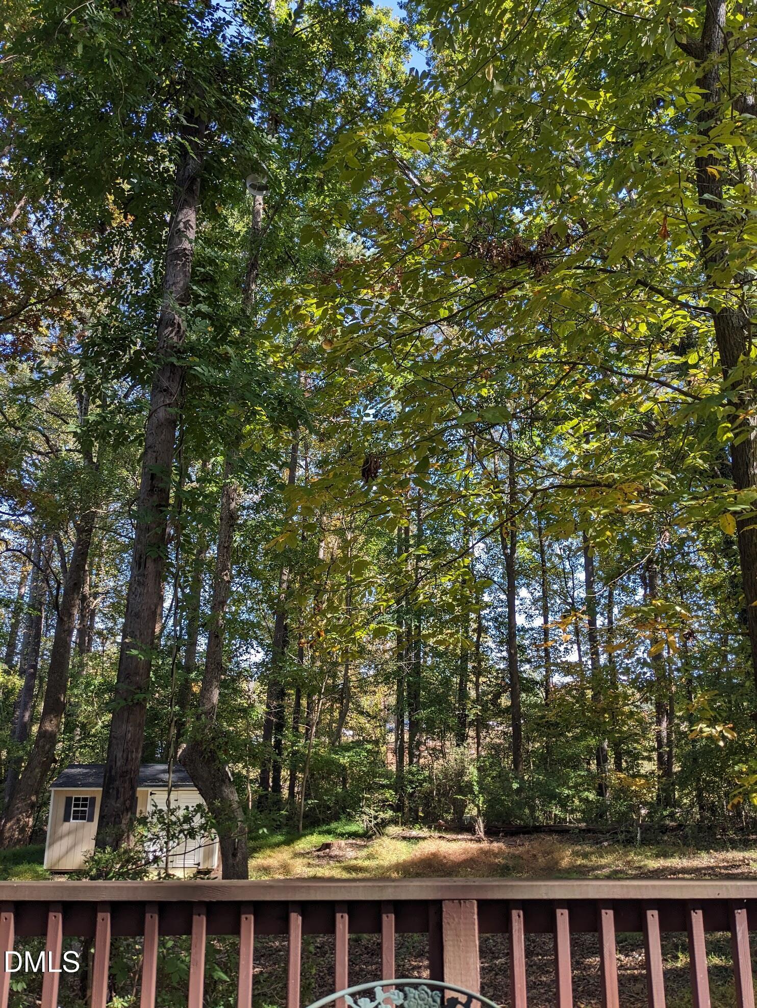 3043 Creech Road Garner, NC 27529 - Photo 36 of 38 a view of a white house with a tree in front of it