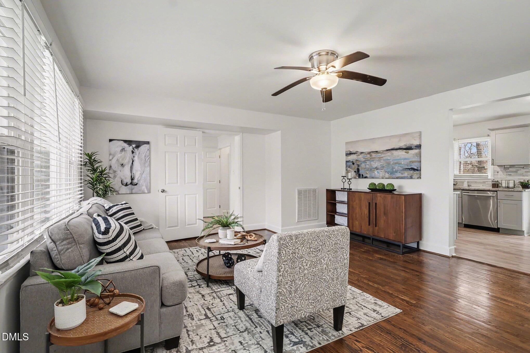 3043 Creech Road Garner, NC 27529 - Photo 4 of 38 a living room with furniture and a large window