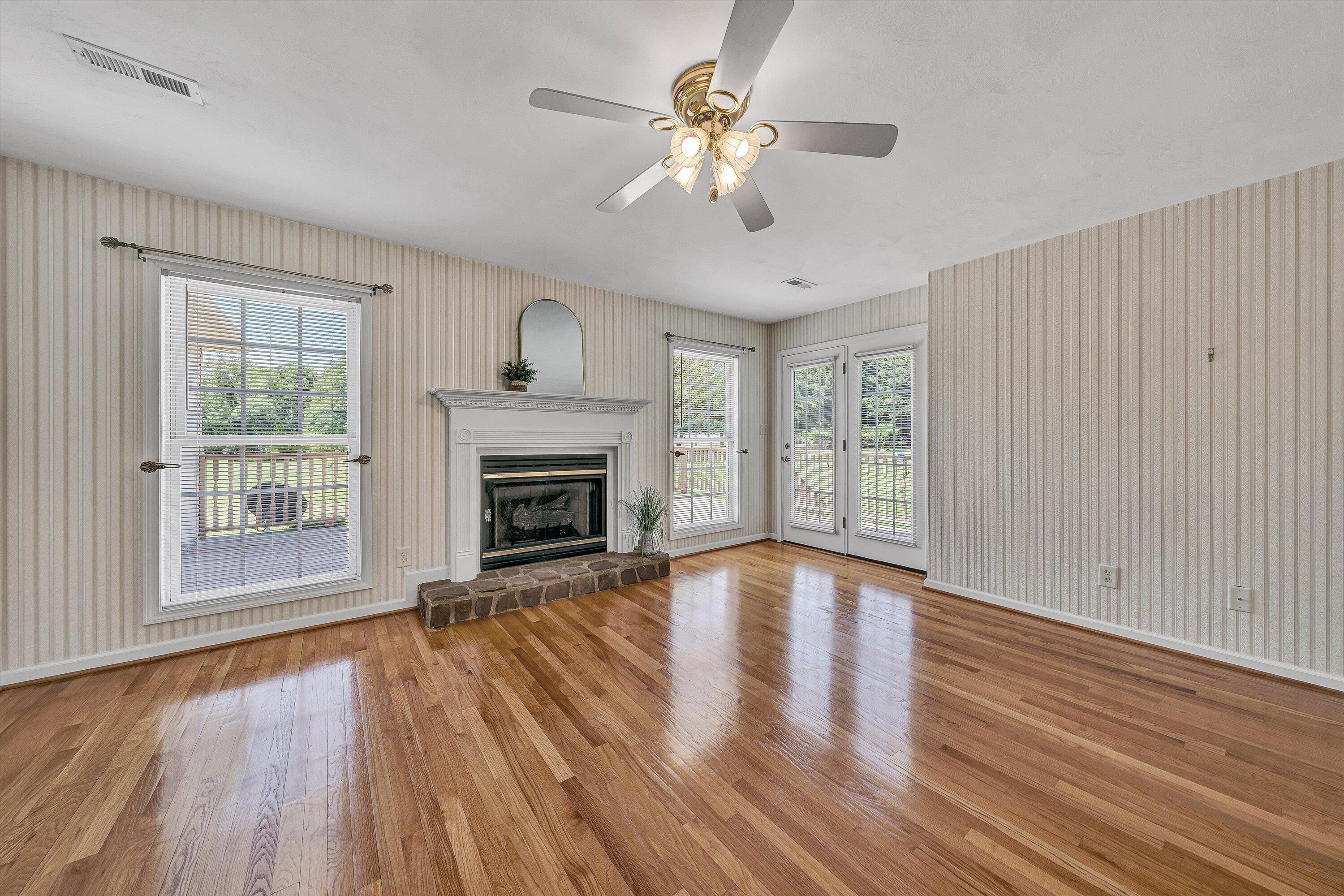 3516 Pinnacle Ridge Road Northeast Roanoke, VA 24012 - Photo 9 of 39 a view of an empty room with wooden floor and a window
