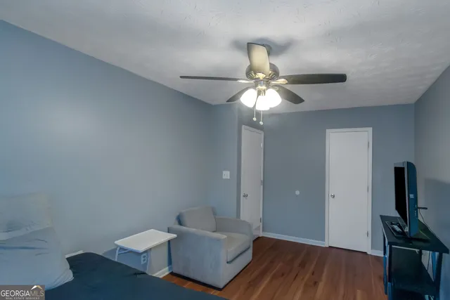 a view of an empty room and wooden floor